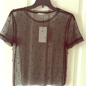 Sheer blouse with black pearl detail